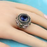 Golden ring with big emerald
