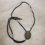 Floral bolo tie with leather rope