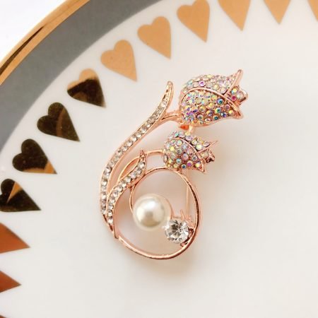 Ornamental brooches with pearl