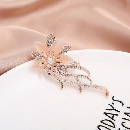 Ornamental brooches with opal and rhinestone