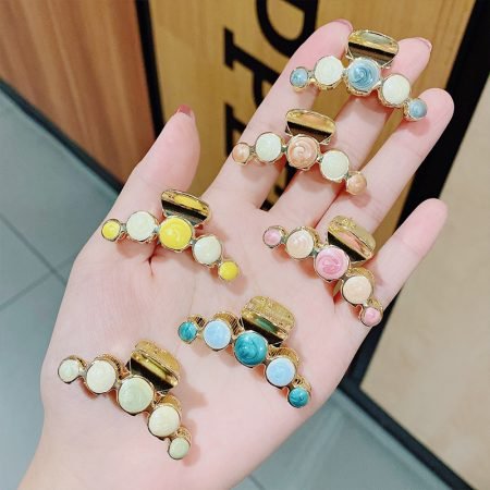 Small metal hair catch with stone