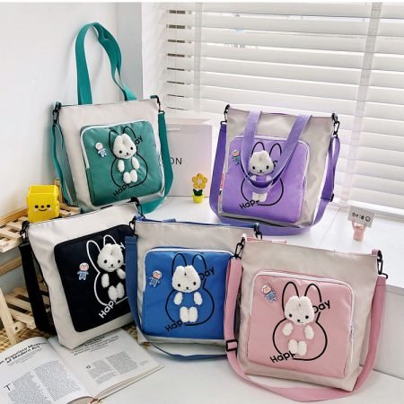 Nylon shoulder bag with big front pocket and bear doll