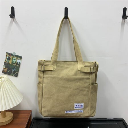 Canvas shoulder bag with side umbrella pocket