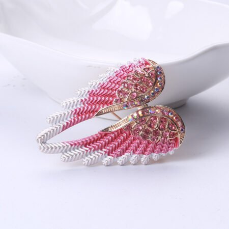 Angel wing shaped brooche with rhinestone