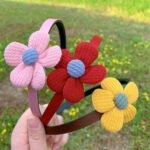 Slim baby headband with flower top