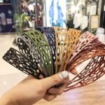 Plastic floral die cut head band