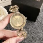 MK hollow band stainless watch