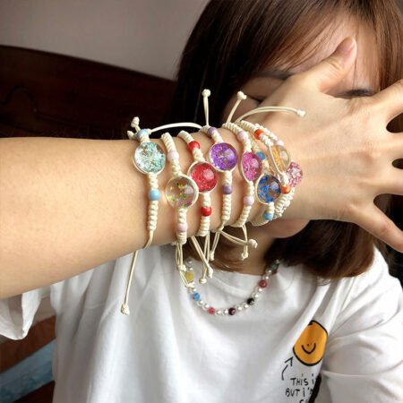 Fastend string bracelet with dried flower pendant